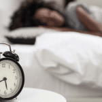 Image shows a woman sleeping with frozen shoulder